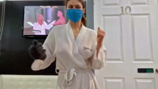 Alexandra Daddario preparing to do a cryotherapy session while wearing a white robe with no bra and hard nipples as she and her friend talk with the camera and then spend some time dancing around and joking with each other all while Alexandra’s breas