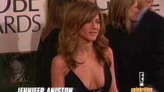 Jennifer Aniston showing some cleavage in a very low-cut black dress on the red carpet at the Golden Globe Awards